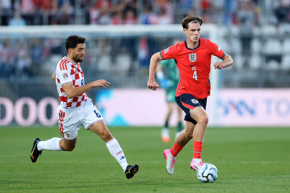 Alex Scott with Mateo Kovacic during the Croatia v England UEFA Nations League 2026/27 group stage match. 