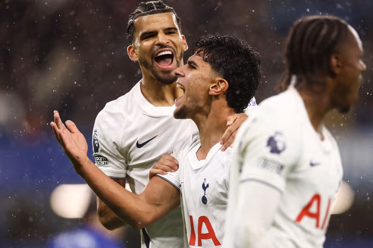 Mateus Fernandes celebrates the first goal with Dominic Solanke and Mathys Tel of Tottenham Hotspur during the Premier League match between Chelsea and Tottenham Hotspur at Stamford Bridge