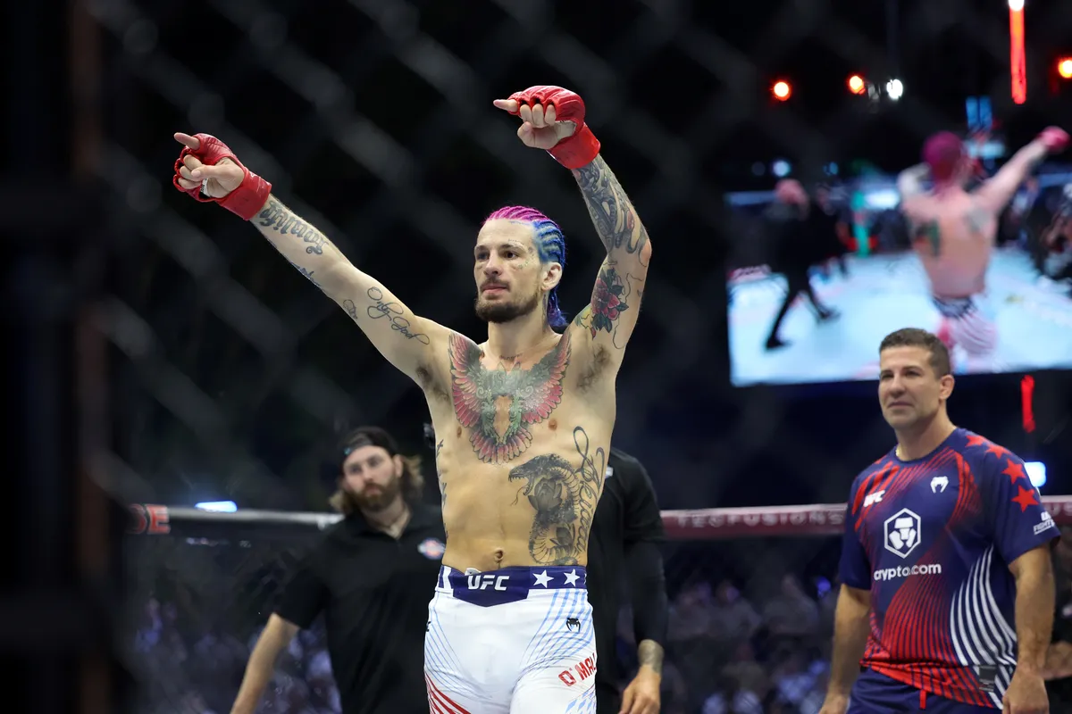 June 14, 2026; Washington, DC, USA; Sean O'Malley (red gloves) celebrates after defeating Aiemann Zahabi (not pictured) during UFC Freedom 250 on the South Lawn of the White House. Mandatory credit: Amber Searls-Imagn Images