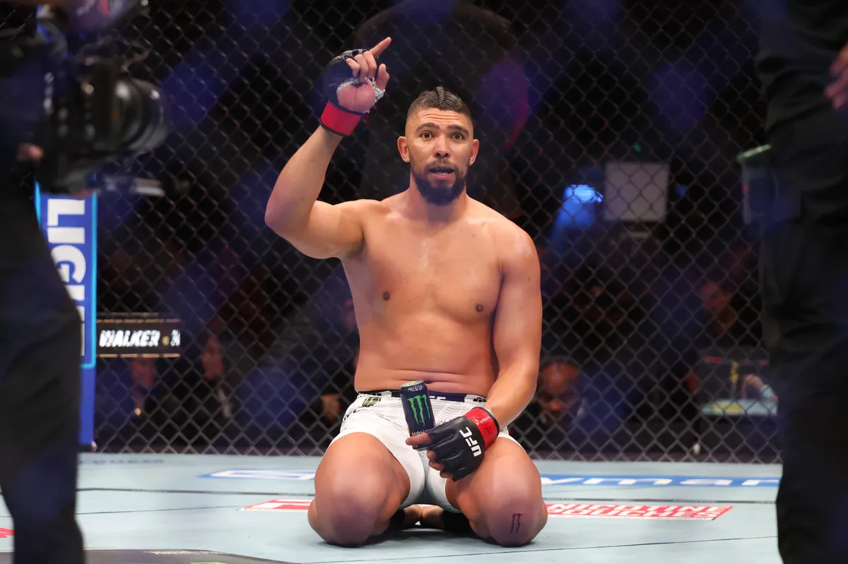 October 3, 2026; Salt Lake City, Utah, USA; Johnny Walker (red gloves) reacts after his fight with Mick Parkin (blue gloves) during UFC 332 at the Delta Center. Mandatory credit: Rob Gray-Imagn Images