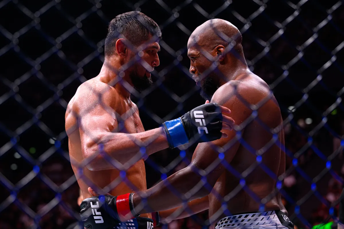 September 5, 2026; Paris, FRANCE; Michael Venom Page (red gloves) fights Nursulton Ruziboev (blue gloves) during UFC Fight Night at Accor Arena. Mandatory credit: By Haljestam-Imagn Images