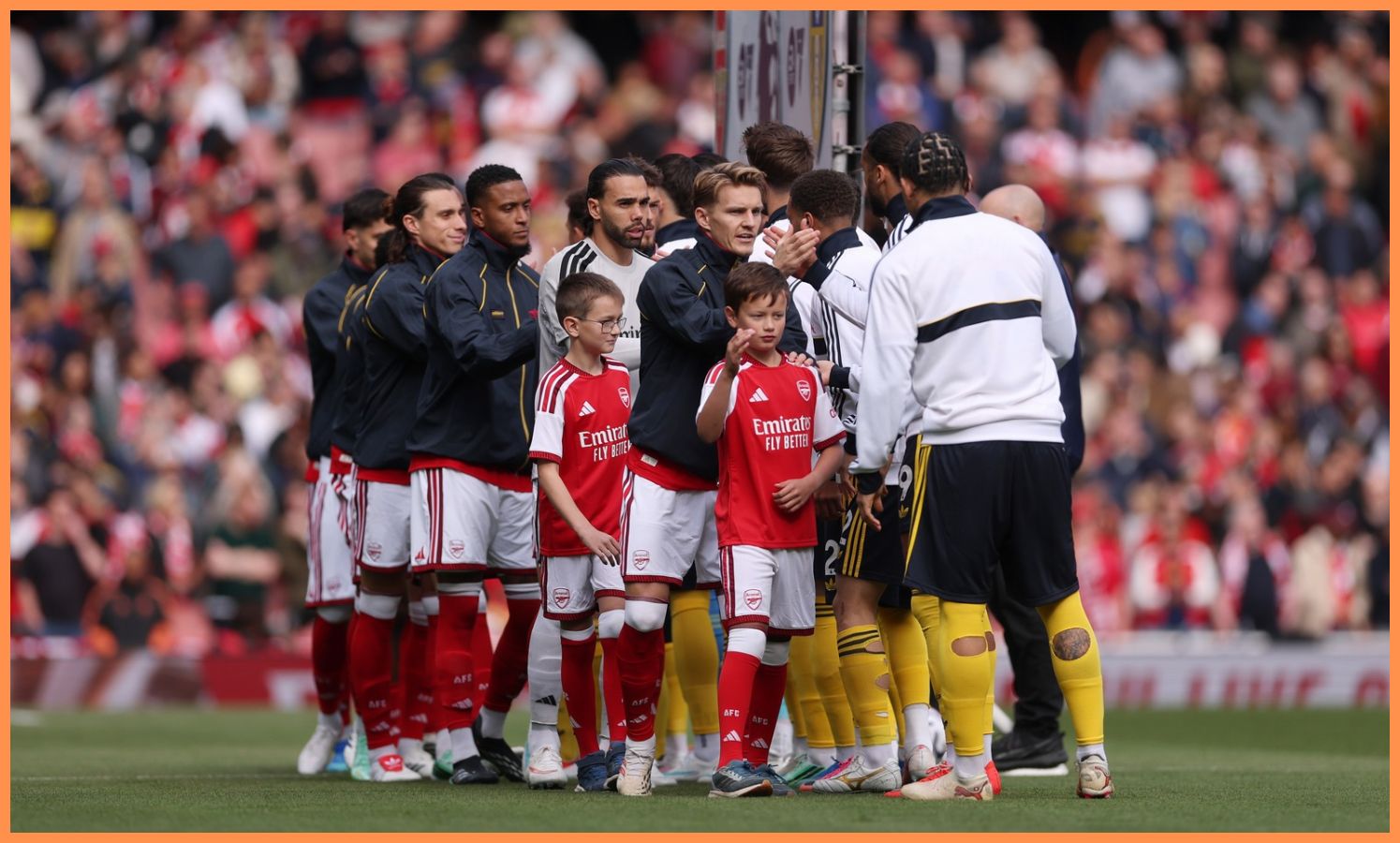 Arsenal players line up at the Emirates Stadium