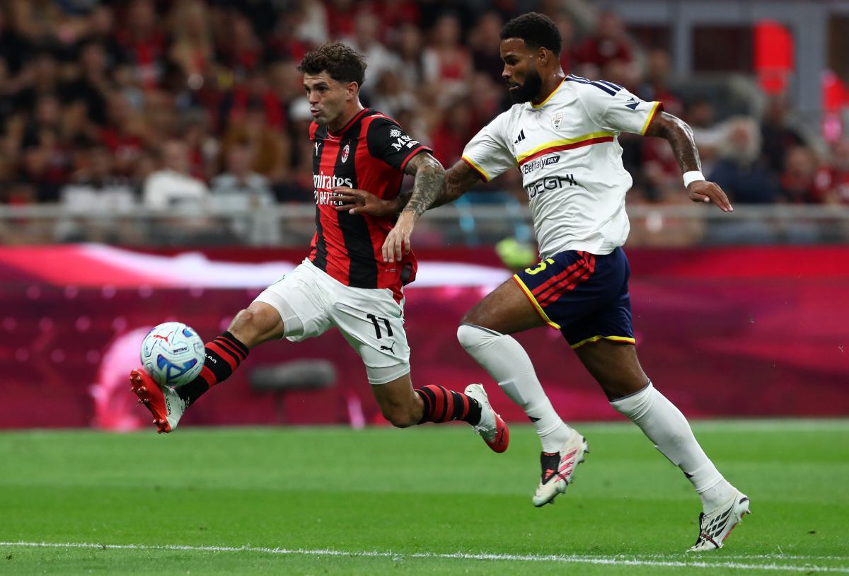 ITALY - SEPTEMBER 20: Christian Pulisic of AC Milan runs with the ball under pressure from Jamil Siebert of Lecce during the Serie A match between AC Milan and Lecce USA at Stadio Giuseppe Meazza on September 20, 2026 in Italy. (Photo by Marco Luzzani/Getty Images)