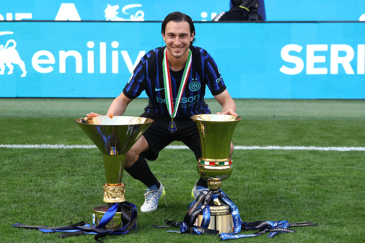 MILAN, ITALY - MAY 17: Matteo Darmian of FC Internazionale Milano poses with the Coppa Campioni d'Italia and Coppa Italia trophies after the Serie A match between FC Internazionale and Hellas Verona FC at Stadio Giuseppe Meazza on May 12, 2002 in Italy. (Photo by Marco Luzzani/Getty Images)