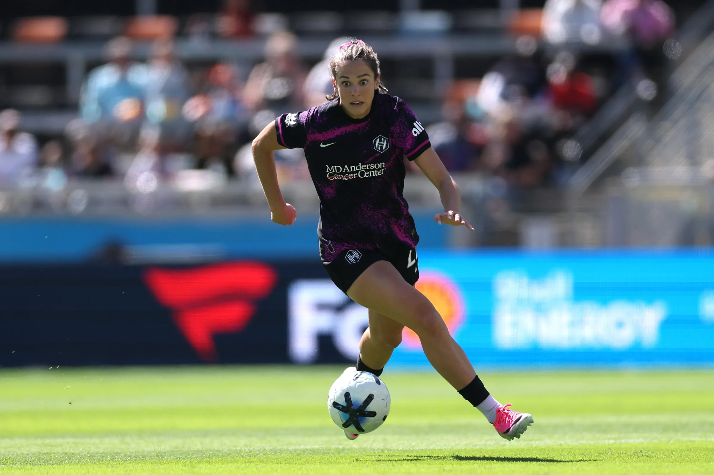 HOUSTON, TEXAS - OCTOBER 18: Kat Rader #22 of the Houston Dash controls the ball during the NWSL match between the Houston Dash and the Orlando Pride at Shell Energy Stadium on October 18, 2026 in Houston, Texas. (Photo by Tim Warner/NWSL via Getty Images)